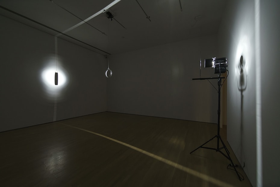 dark room with light and rotating objects