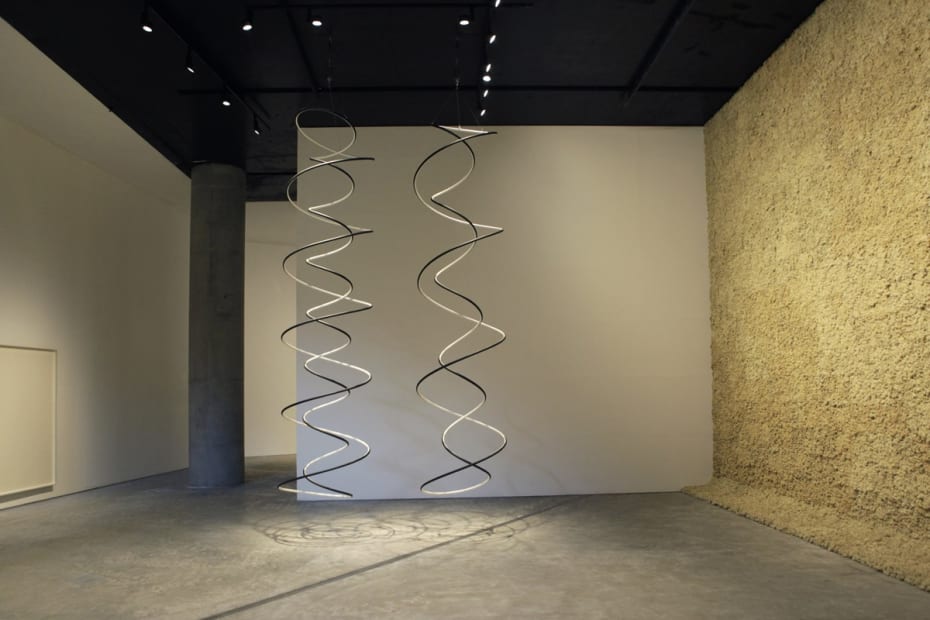 Installation image of Eliasson exhibition, hanging spirals