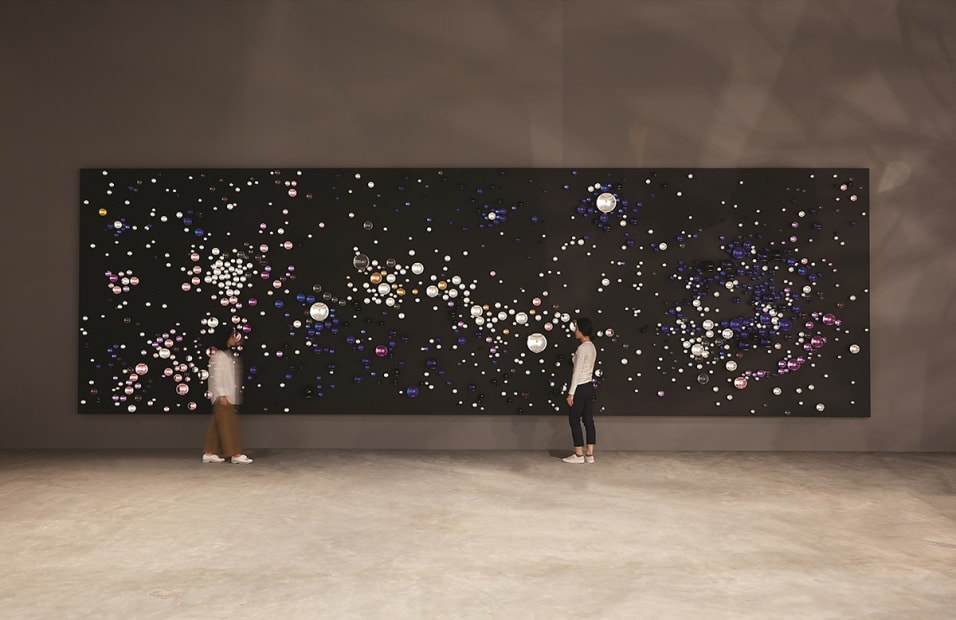Installation image of Eliasson exhibition, walls with spheres