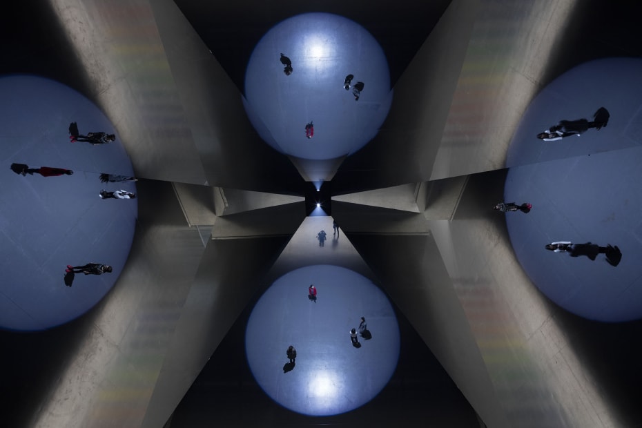 image of installation with reflecting triangular mirrors