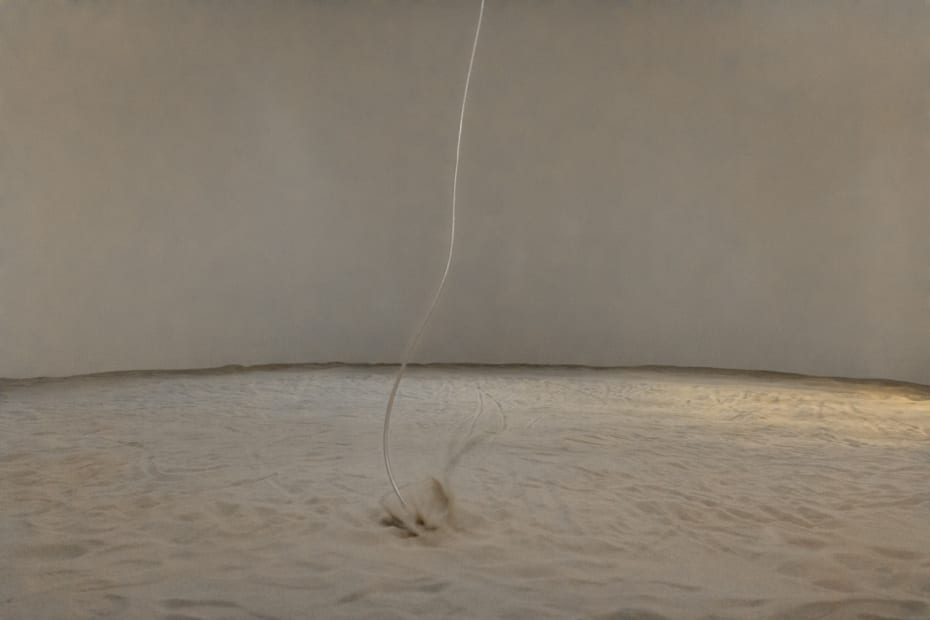 image of sand whirling around room