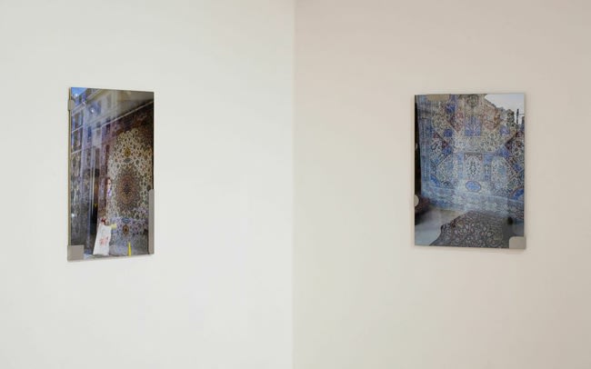 image of photographs installed on a wall