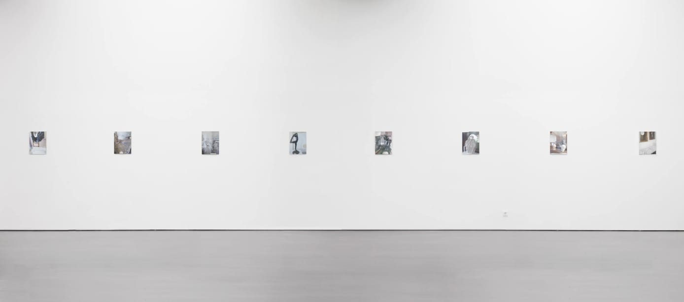image of photographs installed on a wall