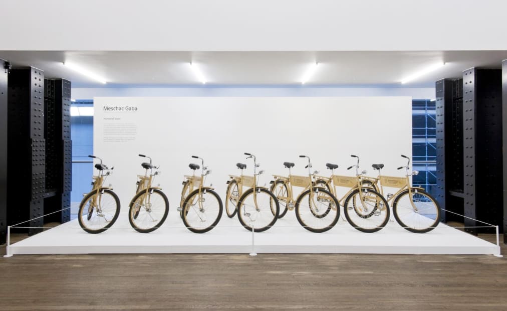 installation image of Meschac Gaba works at Tate, bikes in a line