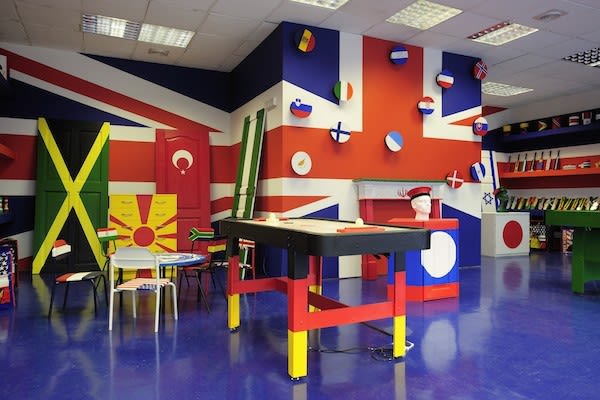 image of room covered in different flags painted on everything