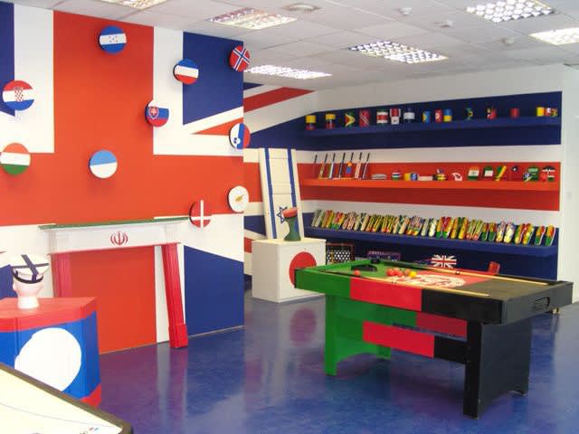 image of room covered in different flags painted on everything