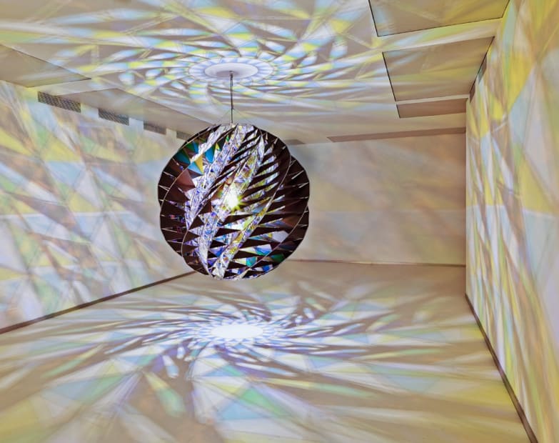 image of spherical light sculpture projections shadows onto the surrounding walls