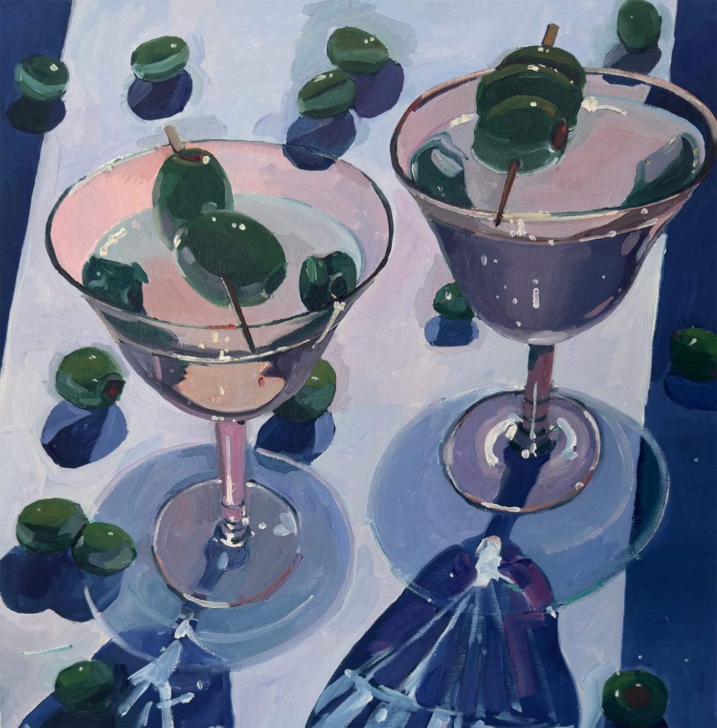 Erika Lee Sears oil painting of two martini glasses with olives. The lighting is dark yet soft as if lit by moon light