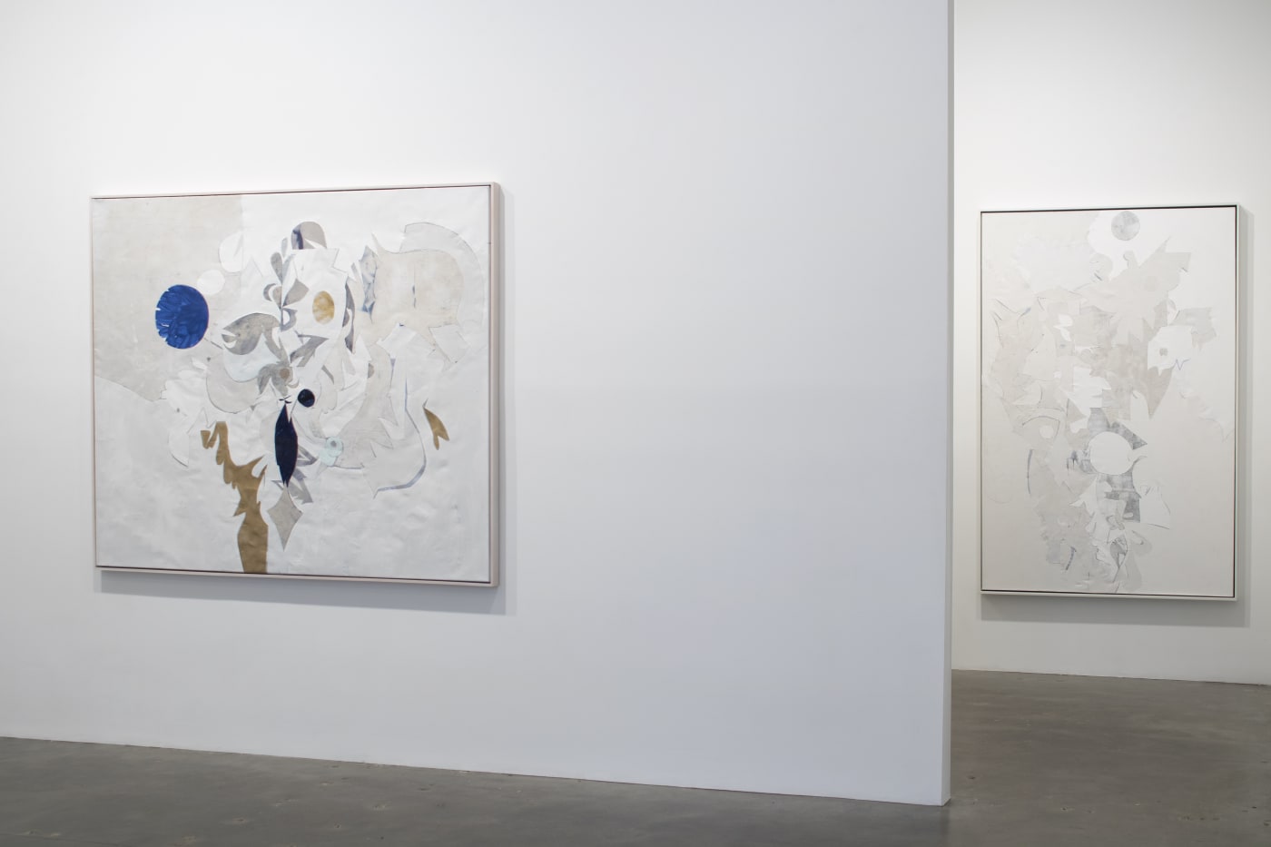 Installation view of Susan Inglett Gallery with two abstract paintings made from collaged remnants of earlier canvases by Ryan Wallace hanging on the walls