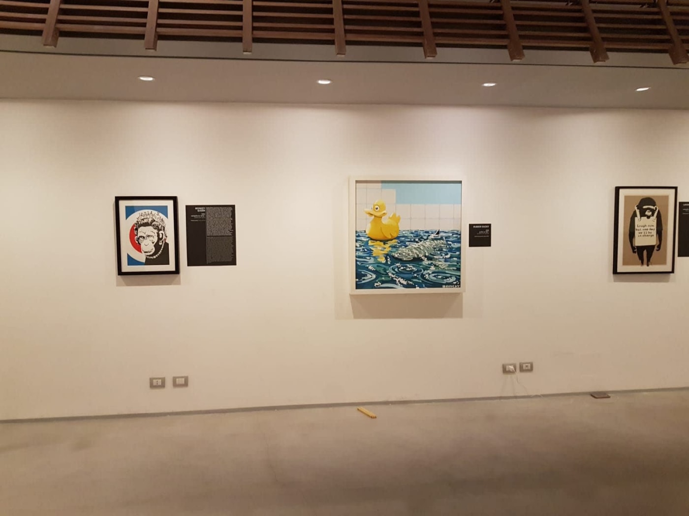 Banksy artworks hanging on wall