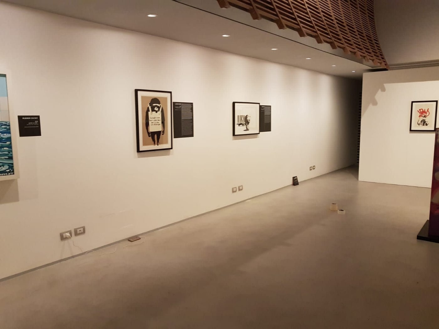 Banksy artworks hanging on wall