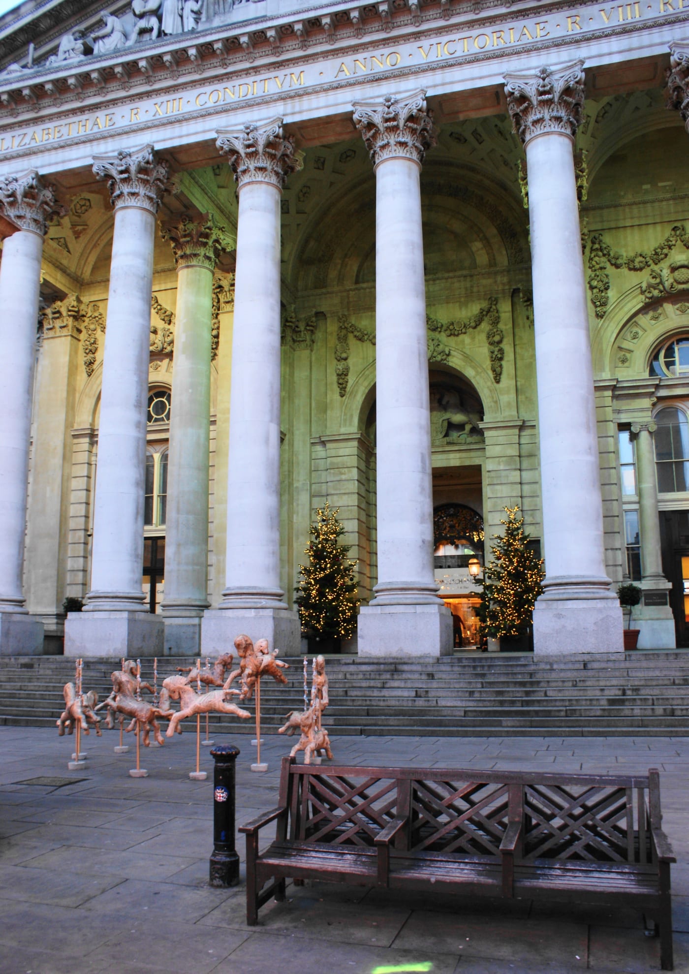 Laura Keeble Money Makes the World Go Round Carousel horses outside londons financial district