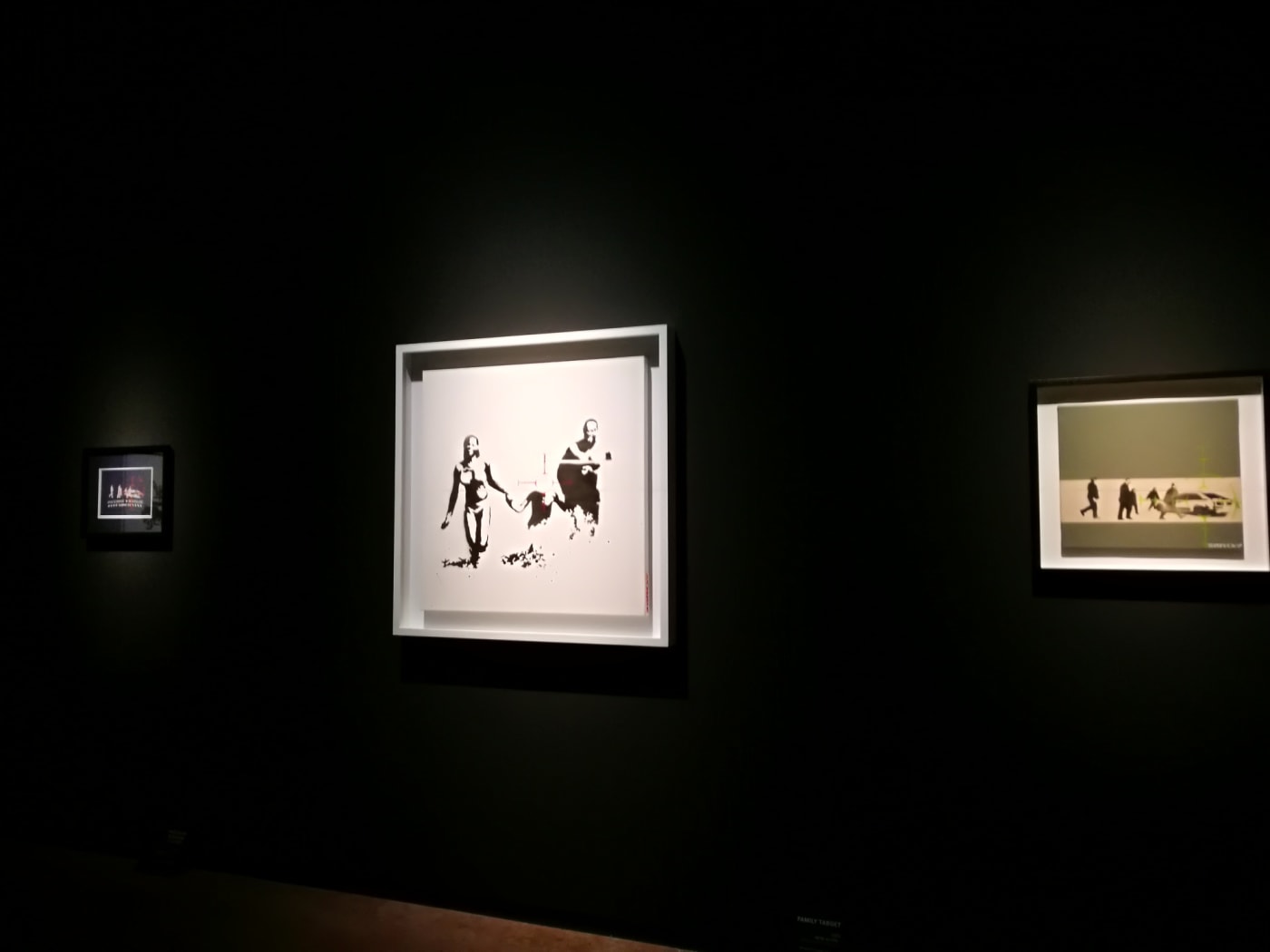 Banksy artwork hanging on wall