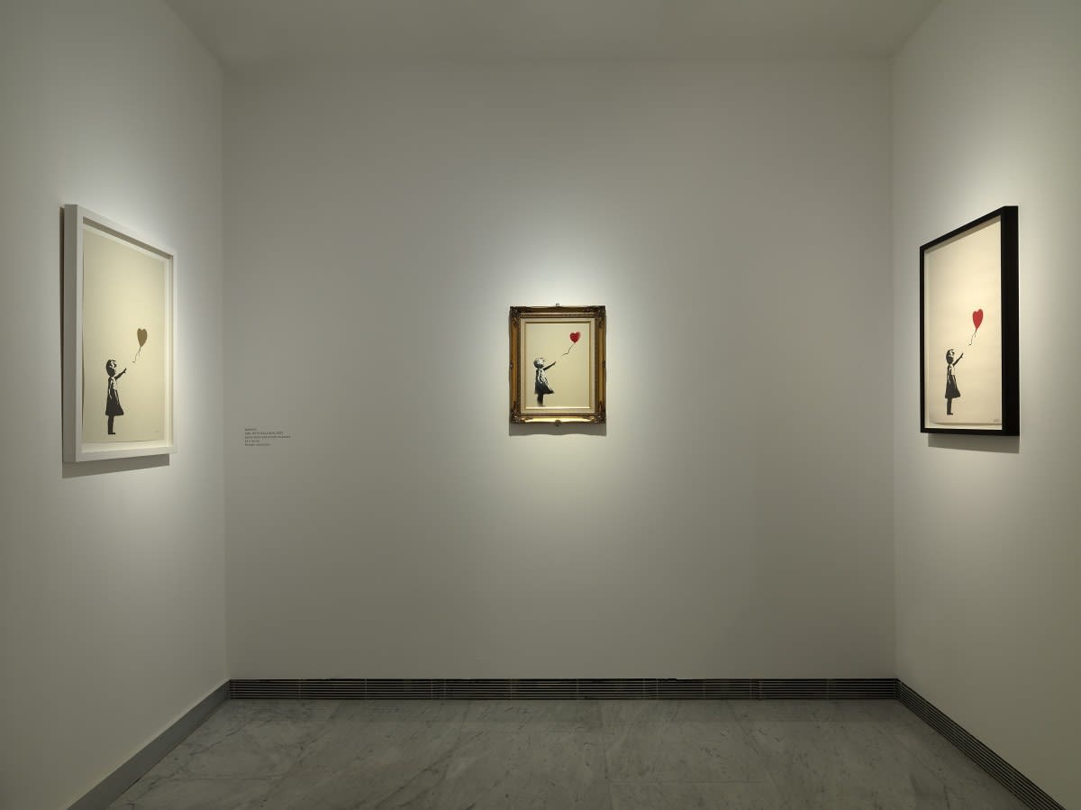 Banksy artworks hanging on wall