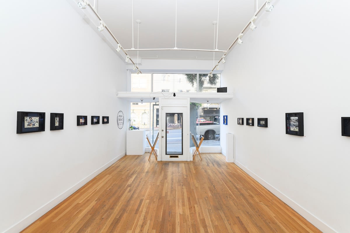 white wall with small framed works by Penny