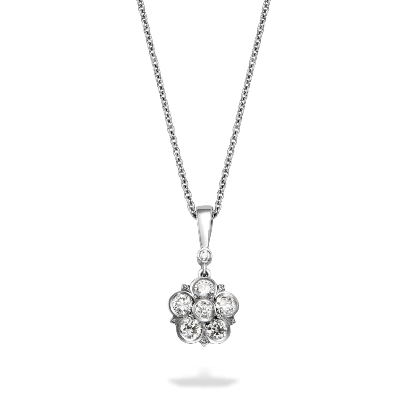 5 old cut diamonds surrounded by another old cut diamond in a floral motif, which hangs by a diamond and bail and set in platinum with a platinum chain. On a white background