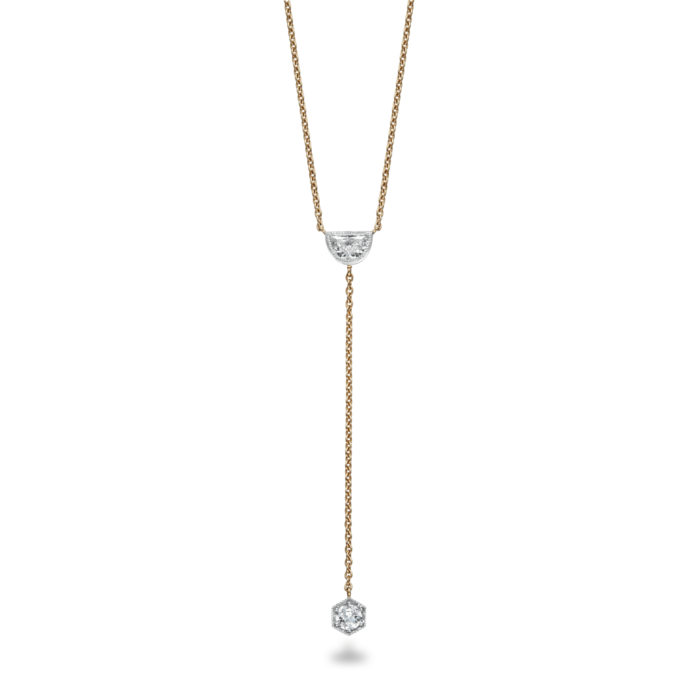 Lariat Pendant featuring a half moon diamond set in platinum with a millegrain edge with a round diamond hanging from gold chain set in a hexagon setting with millegrain edge on white background