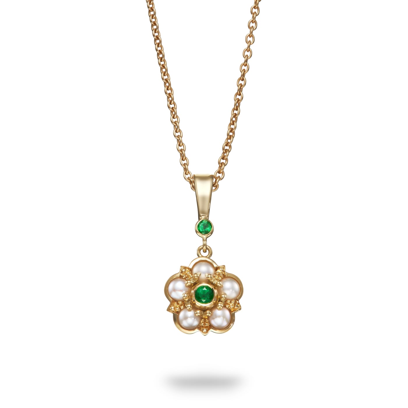 Aril Jewels pearl and emerald rose pendant from the Elizabeth collection in an Elizabethan inspired rose design. 18k yellow gold. On white background.