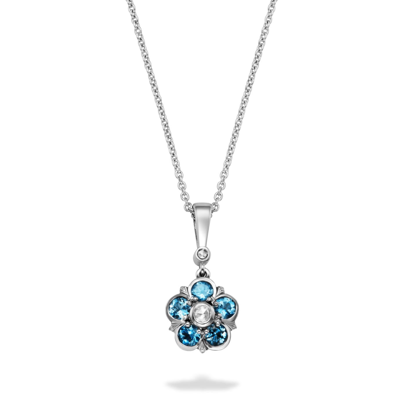 Aquamarine and diamond pendant in a floral motif set in platinum, which hangs from a diamond and bale.