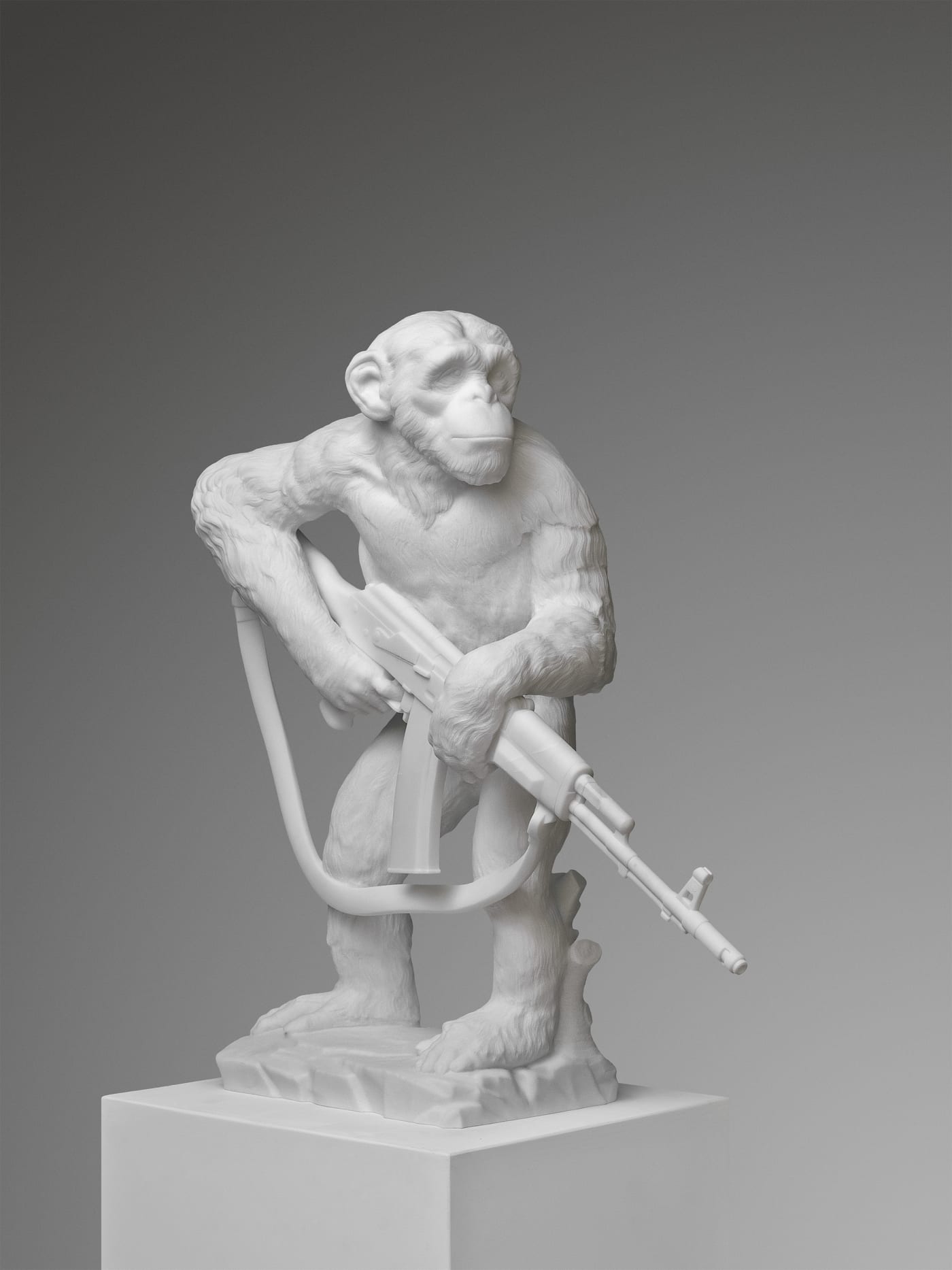 Filippo Tincolini's 'Dystopian Animals' marble sculpture: Monkey with AK-47, left front view.