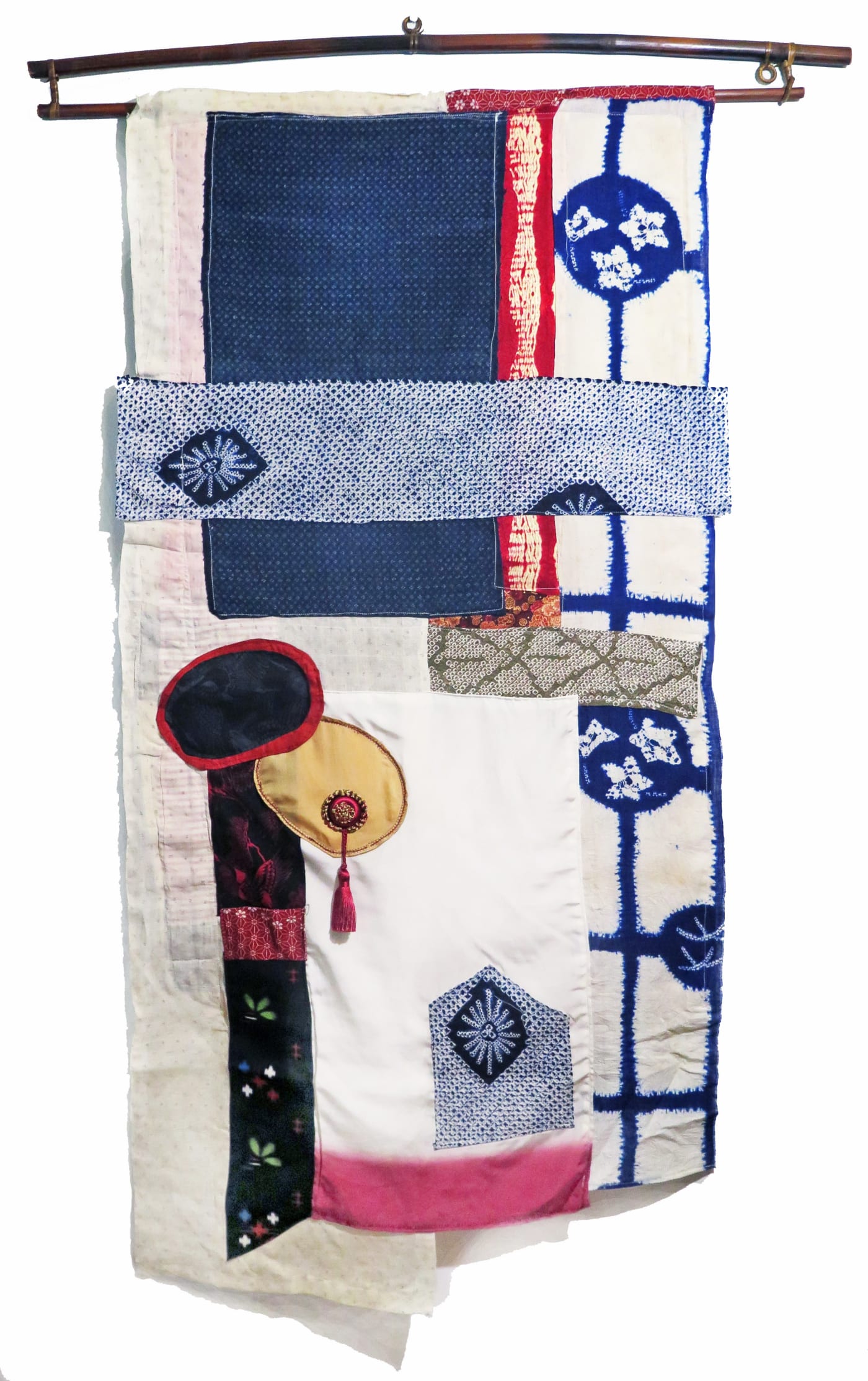One Version of the Story, 2018 Vintage kimono silk and Japanese linen kusakizome kazuri backed with canvas. One round area stuffed with cotton batting, thread, tassel, dowels and wooden curtain rod. 53 x 26 1/2 inches
