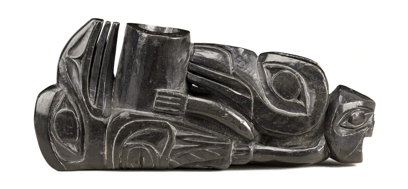 Lot 53 UNIDENTIFIED ARTIST, HAIDA Ceremonial Pipe, c. 1830s argillite with metal stand, 4 x 5.25 x 1.5 in (10.2 x 13.3 x 3.8 cm) Estimate: $3,000⁠ — $5,000 Price realized: $3,360