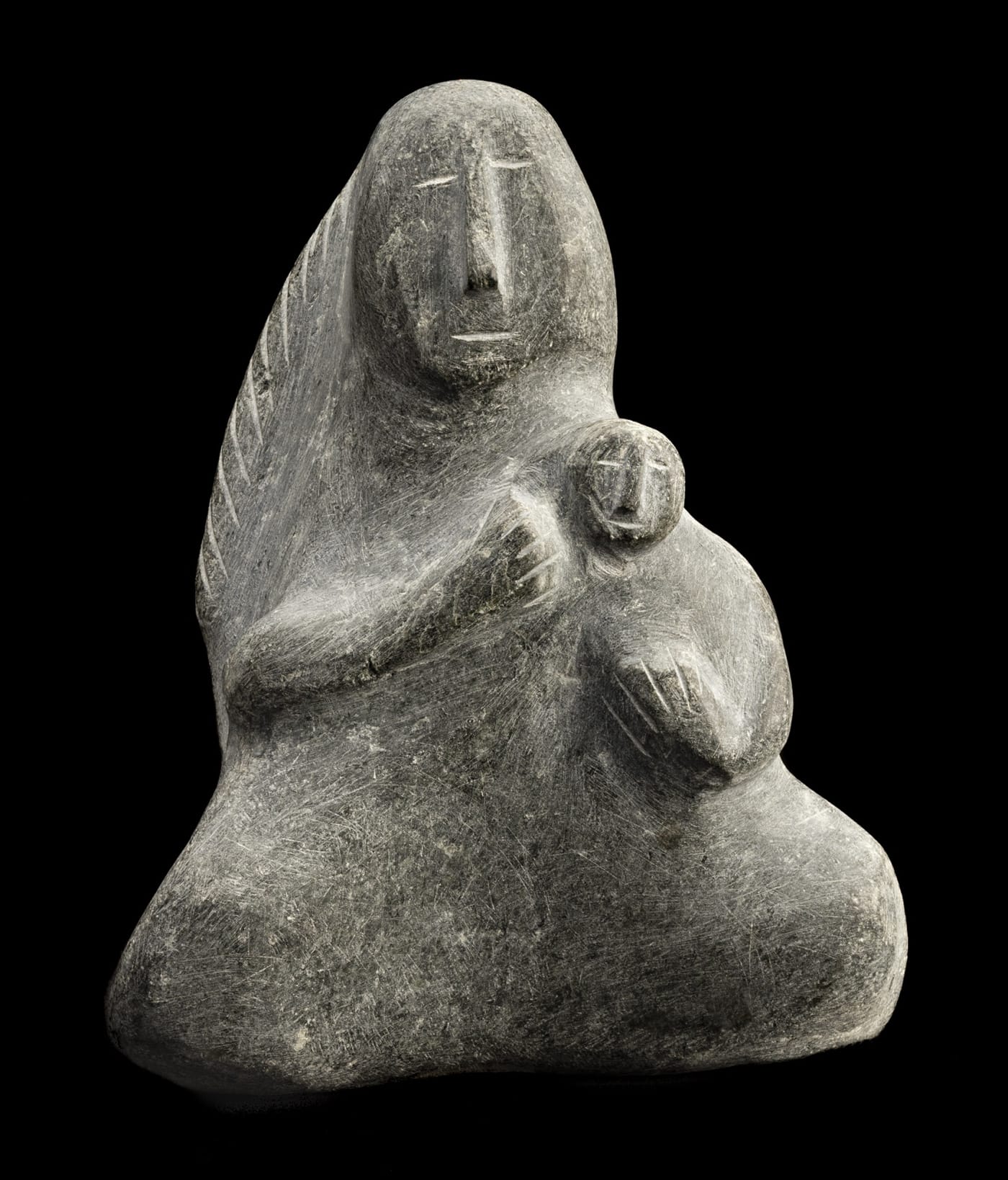 Lot 59 ELIZABETH NUTARAALUK AULATJUT (1914-1998), ARVIAT (ESKIMO POINT) Mother and Child, c. 1970-72 stone, 8 x 6.5 x 3 in (20.3 x 16.5 x 7.6 cm) Estimate: $6,000⁠ — $9,000 Price Realized: $6,160