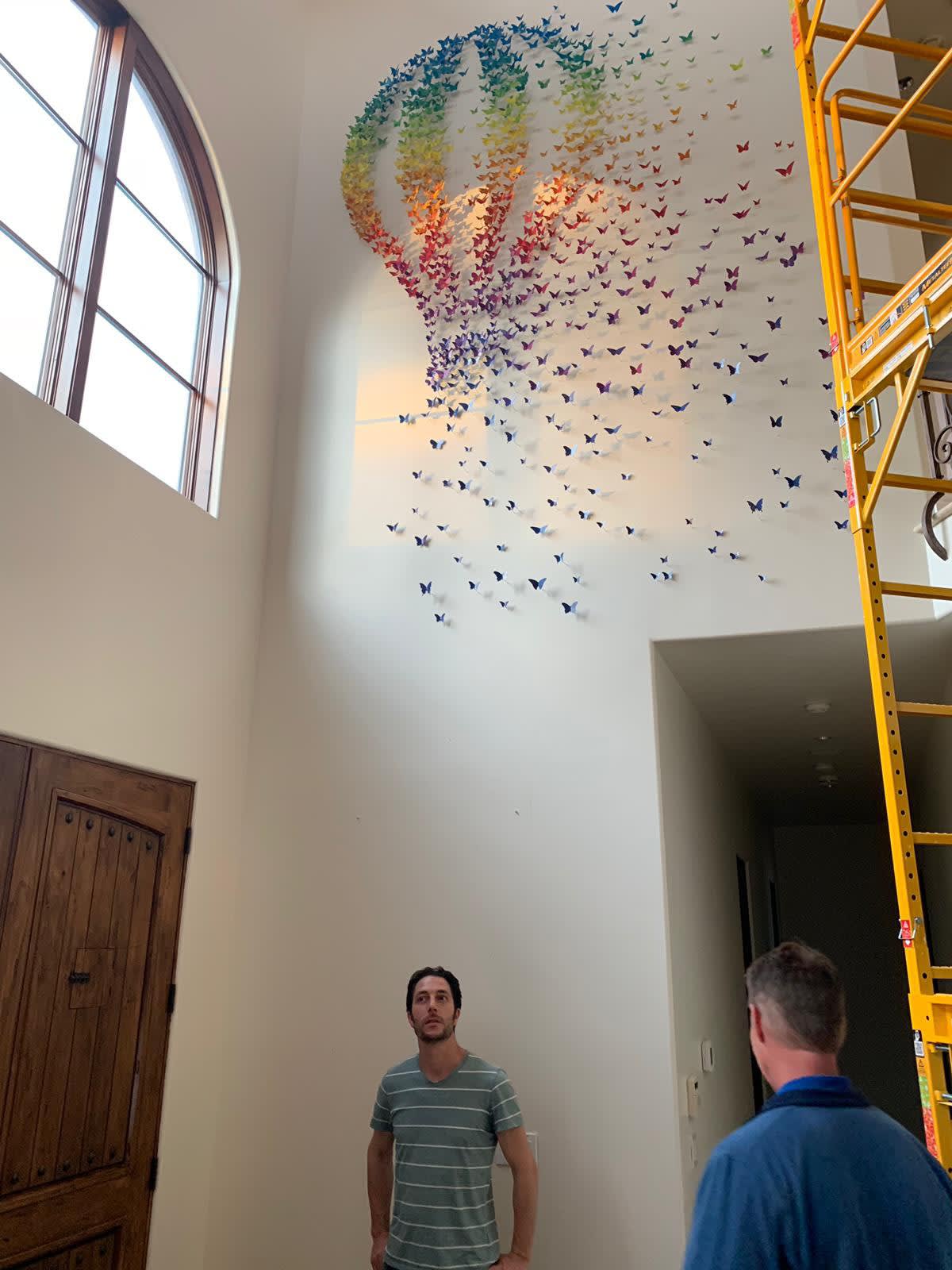 Joel Amit posing with completed installation in client's home Los Angeles, CA