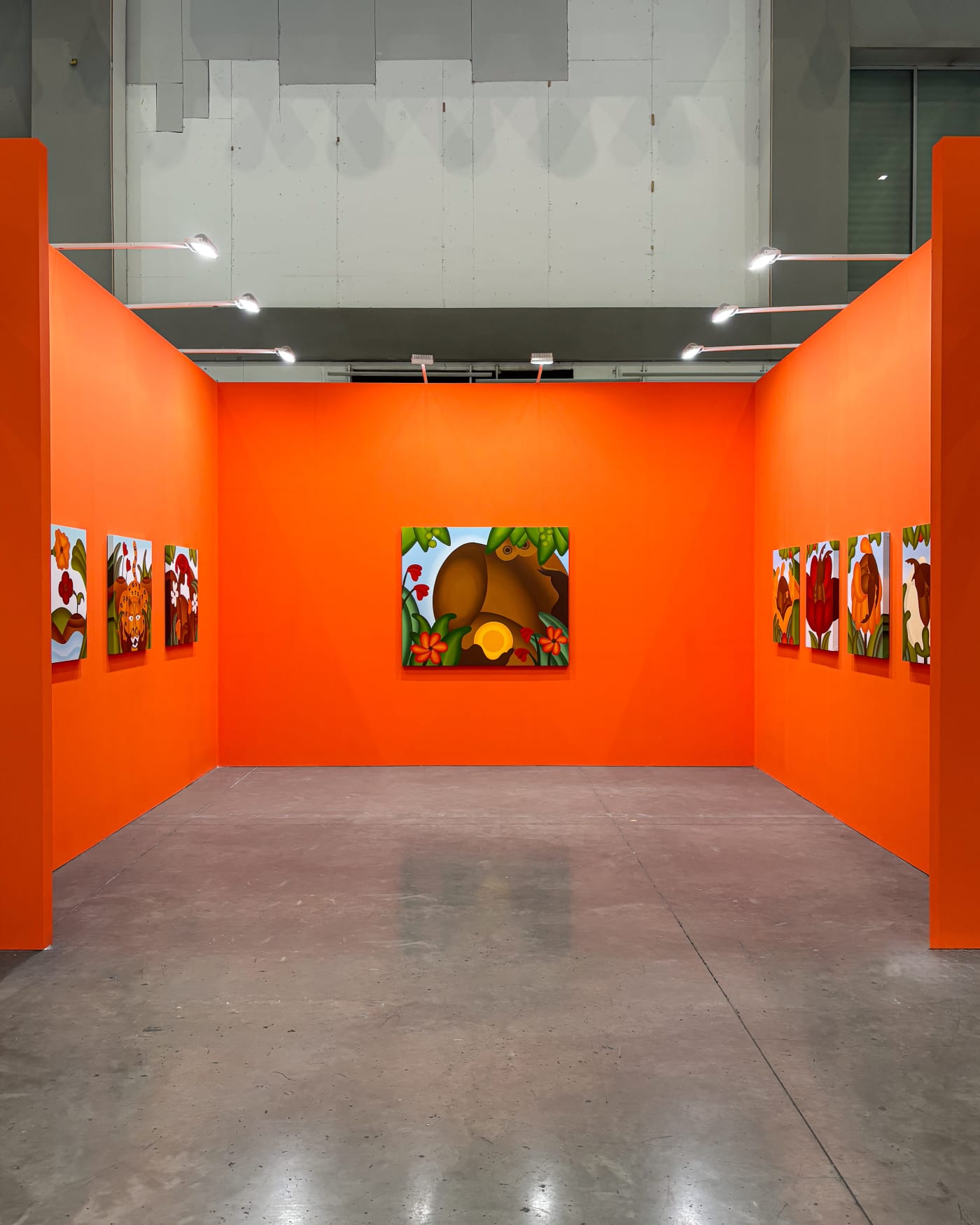 installation view of Bianca Nemelc's solo show in Taipei, bright orange walls with colorful paintings of abstracted flowers