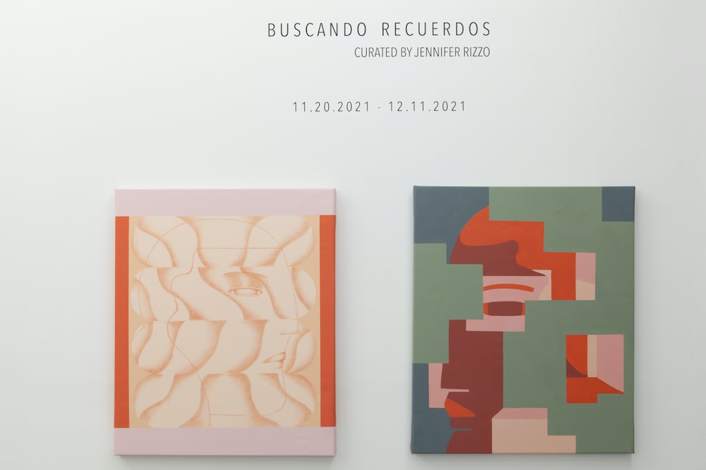 Installation view of "Buscando Recuerdos" group exhibition,  two abstract paintings under exhibition wall text 