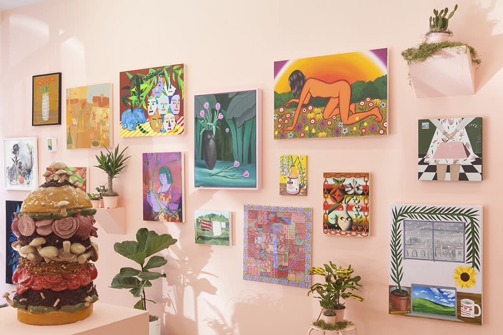 installation view of Lush 2022, gallery with peach walls and floral / plant themed artwork