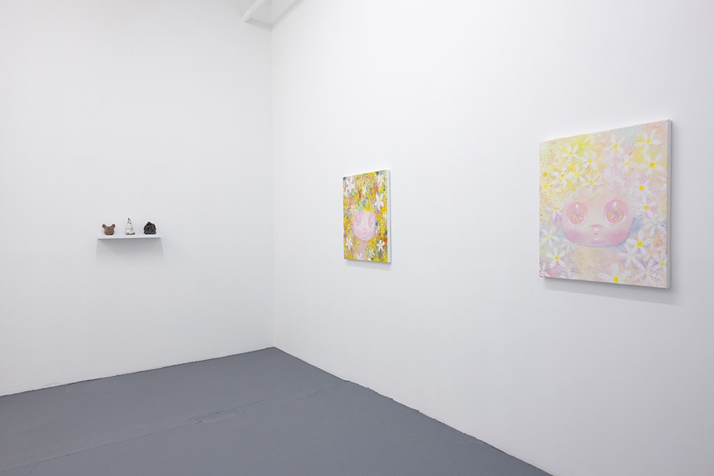 art installation image of three sculptures and two paintings by artist So Youn Lee in white walled room for her show "Over the Moon"