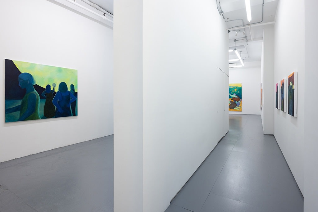 Installation image of blue and green Genevieve Cohn paintings