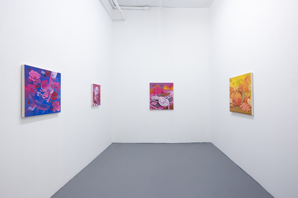 installation image of bright colored paintings by Megan Ellen Macdonald