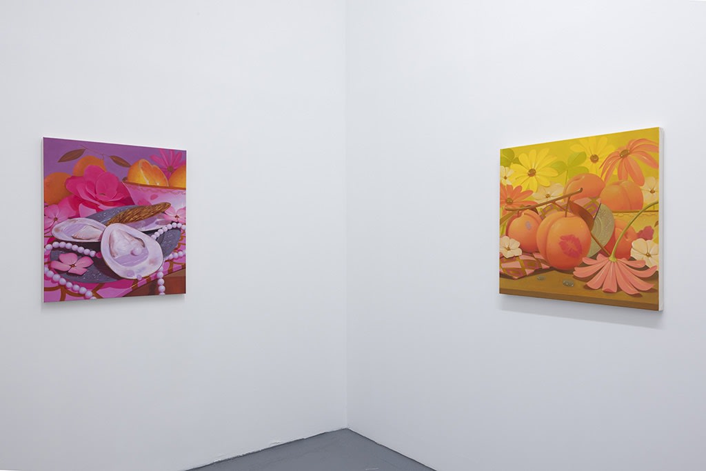 installation image of bright colored paintings by Megan Ellen Macdonald