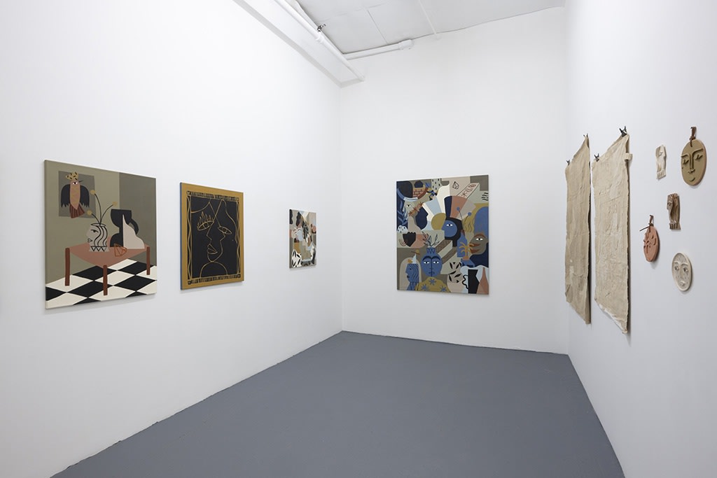 Installation image of collage like artworks from artist Madi