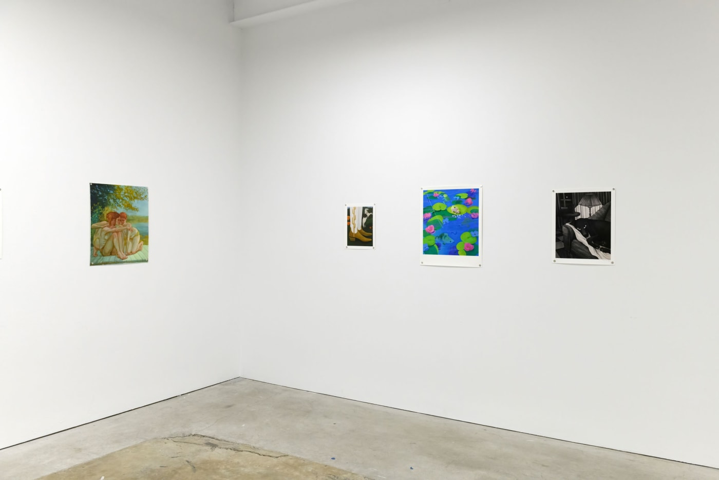 Installation photo of Multiples. Prints from left to right, Rachel Gregor - "On the Dock", Angela Burson - "The Valley", Megan Ellen MacDonald - "Trolling in The Shallows", Angels Fang Zirbes - "Dog on Couch".