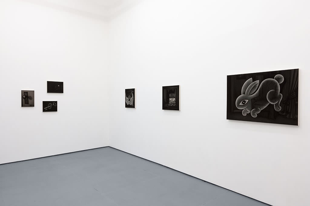 Installation view of Angela Fang Zirbes exhibition "House & Ghosts" featuring grey scale paintings on white walls