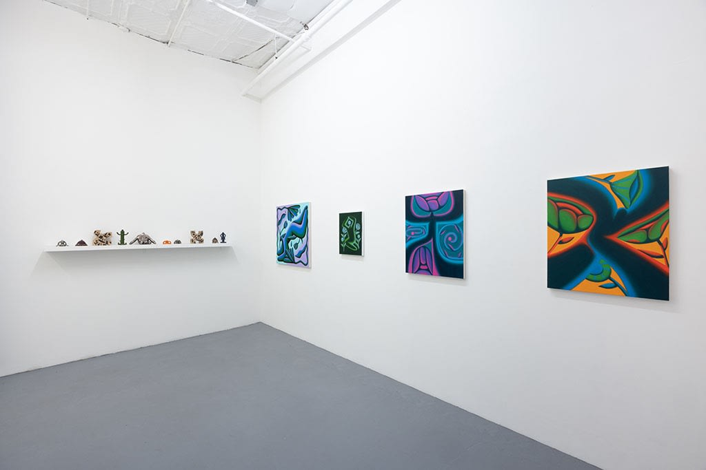 installation picture of Jocelyn Tsaih's "The Garden is Open" featuring paintings on the right wall and small statues on the left
