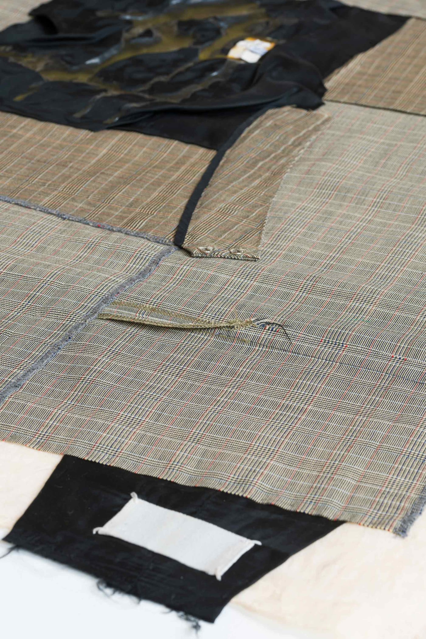 After Cutting, 2024 Martin Margiela wool suiting skirt and lining 2000-2001, polyester thread, cotton muslin, acrylic paint, latex 130x99cm