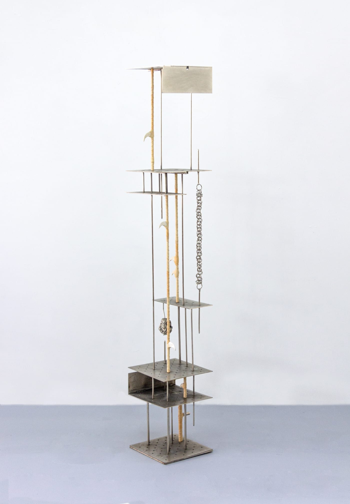 fig 39.3 blue bear, 2024 Nickel-plated steel, porcelain, leather, nickel-plated volcanic rock 69½ x 11 x 11 in.