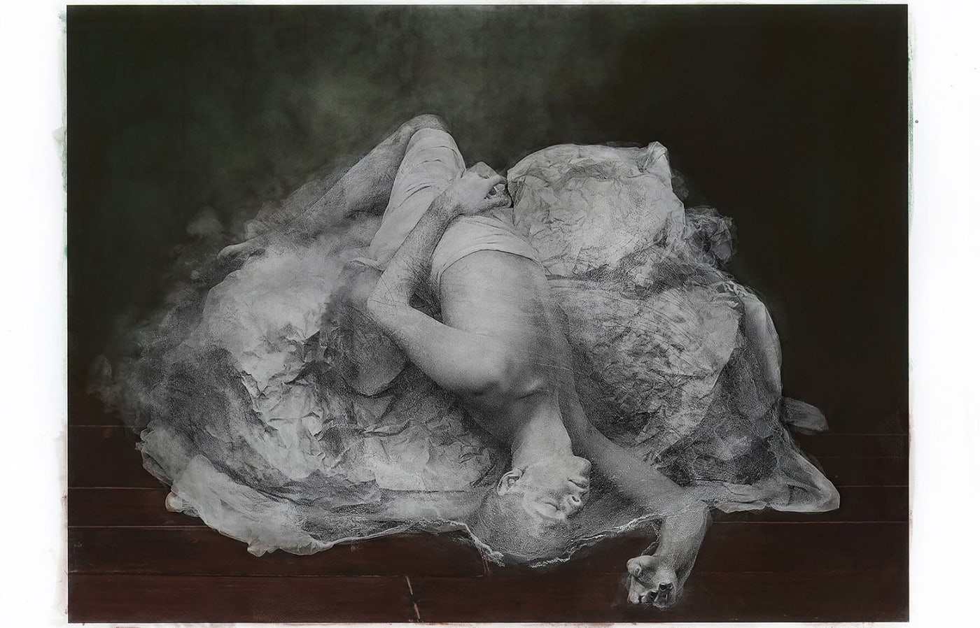 Katie Eleanor, Hand coloured print, portrait of a young man laying semi nude on a bad, sleeping, falling with head and hand down to the floor, sculpture like, human sculpture