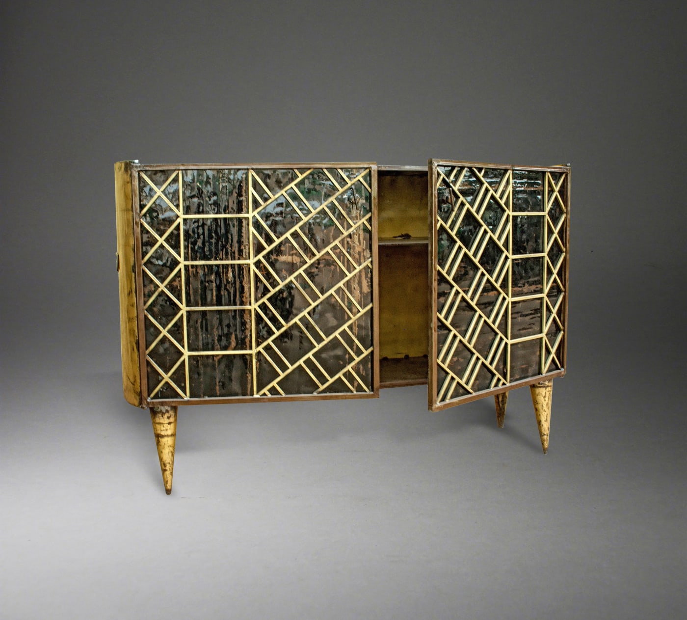 Cabinet By Hamed Ouattara, Burkina Faso Re-callibrated oil drums with patterns inspired by African textiles Artist’s metal tag