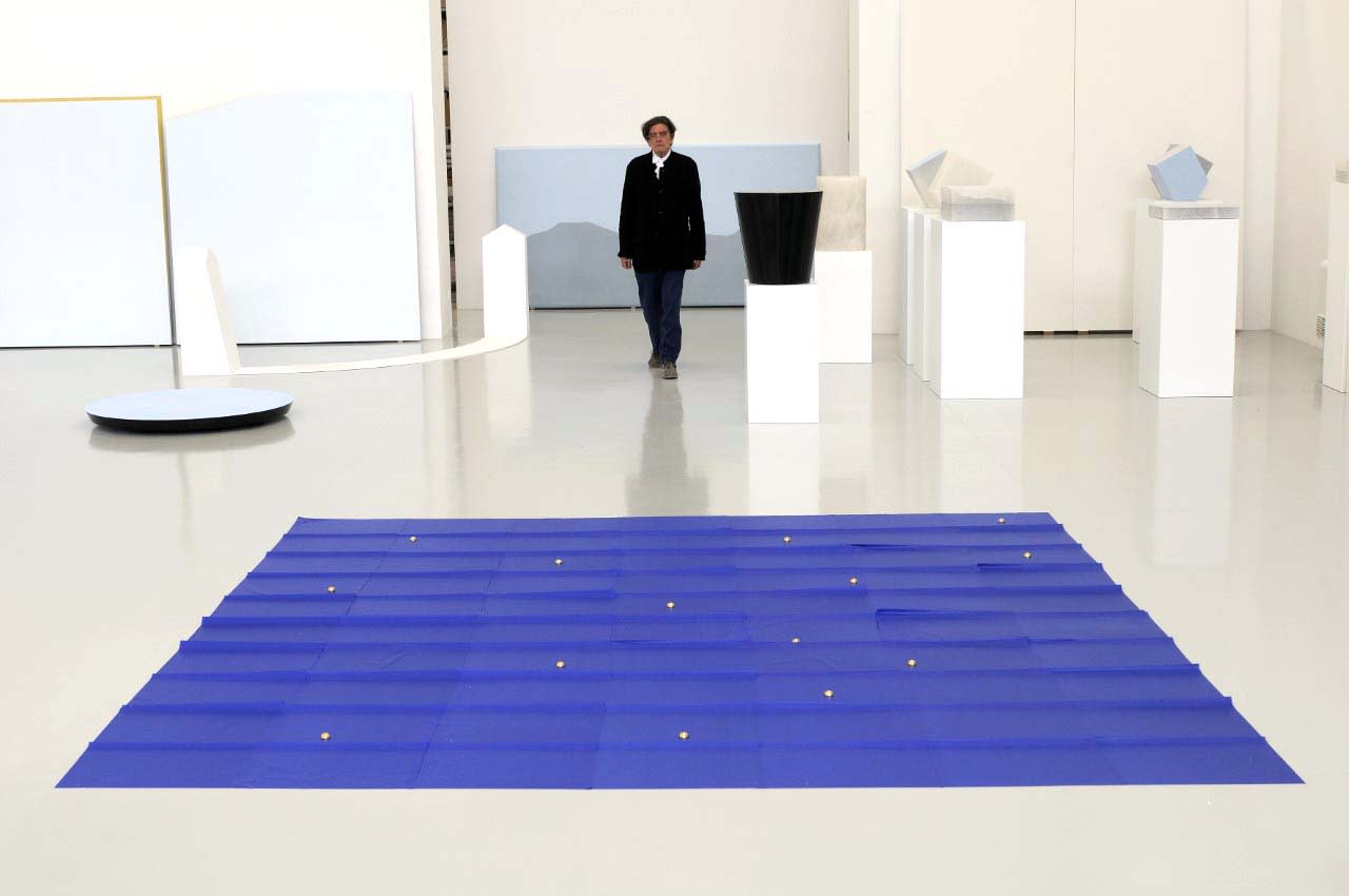 Spalletti examines his work in his studio.