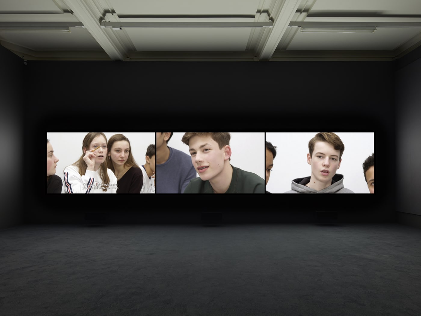 Installation view of Rineke Dijkstra's video projection "Nightwatching"