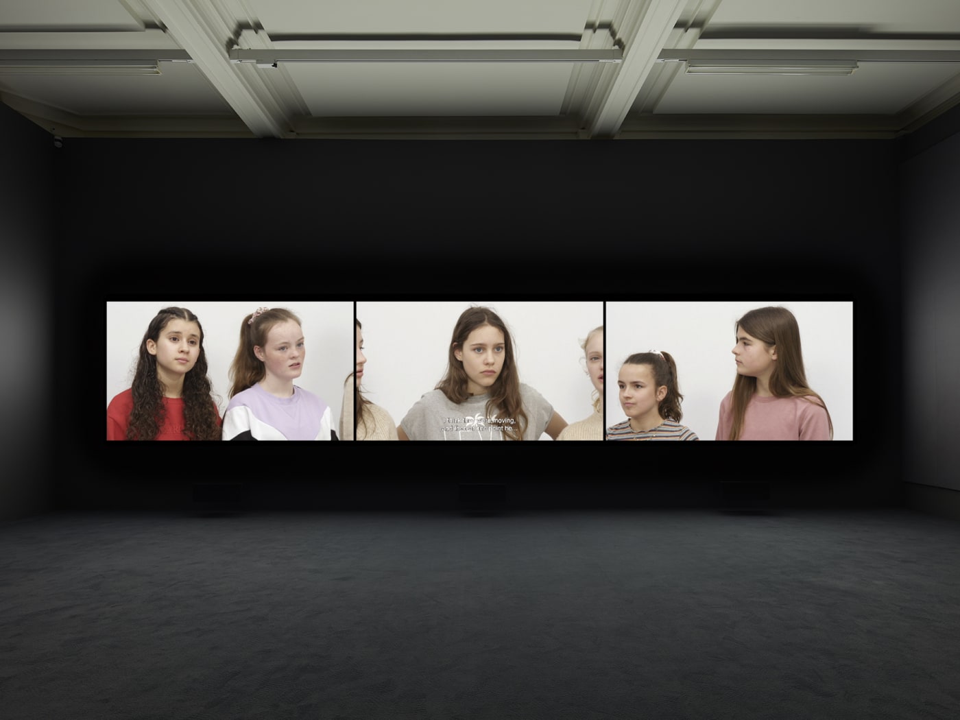 Installation view of Rineke Dijkstra's video projection "Nightwatching"