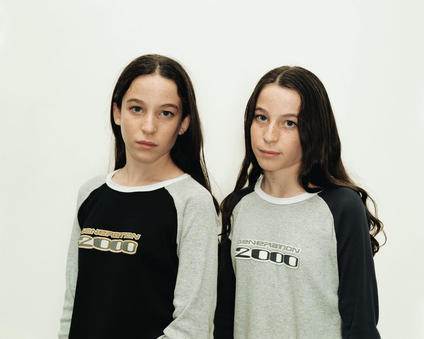 A Rineke Dijkstra portrait of twin girls wearing matching t-shirts