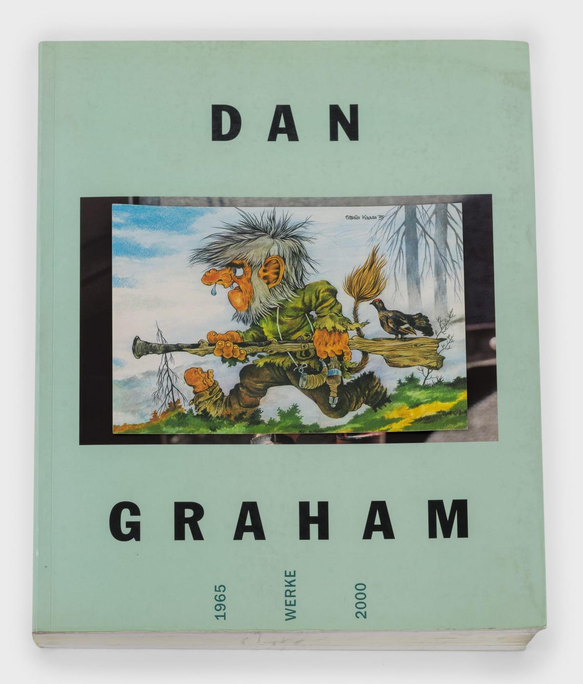 A postcard book featuring an illustration of the artist Dan Graham on the cover with the words Dan Graham on the cover