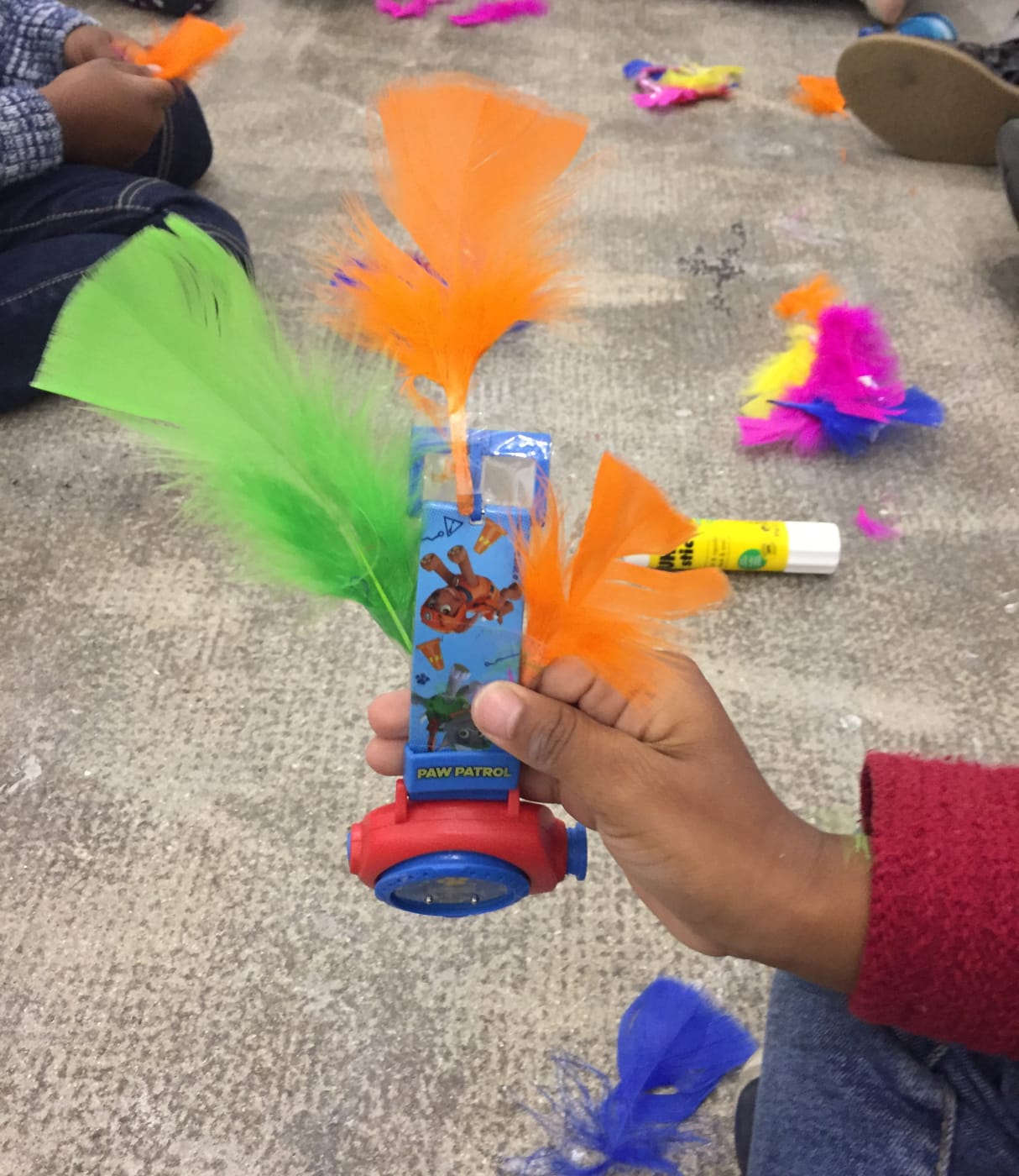 Kids on the floor of Marian Goodman Gallery in Paris working on crafts