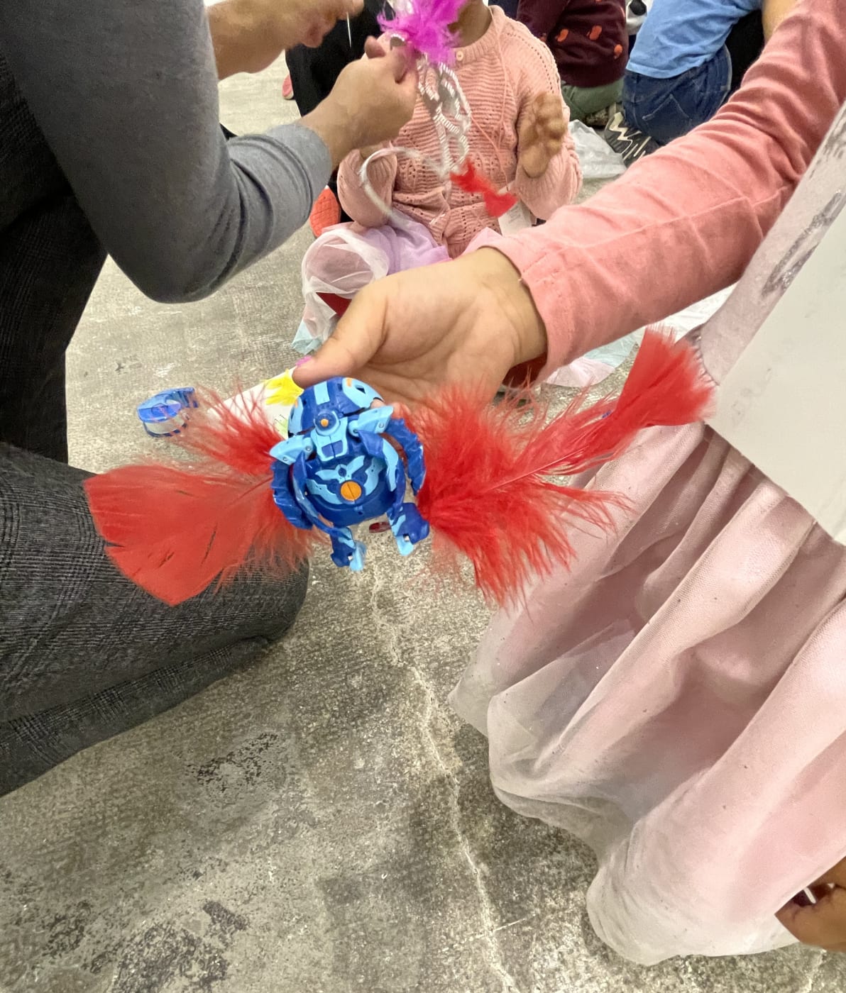 Kids on the floor of Marian Goodman Gallery in Paris working on crafts
